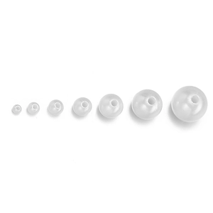 Macro shot of seven white ABS imitation pearls in different sizes with pre-drilled holes