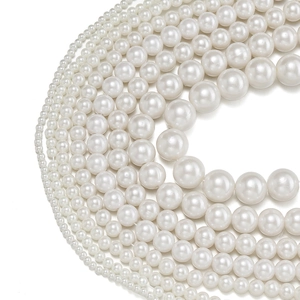 Various sizes of polished white ABS pearl beads arranged from 3mm to 14mm for DIY jewelry