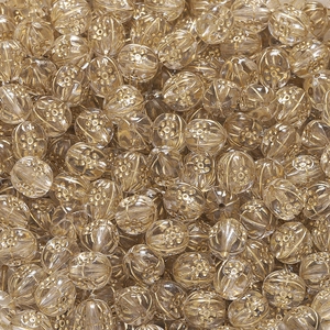 Makro-Detail von Acrylperlen mit goldenem Blumenmuster für DIY-Schmuck und Basteln