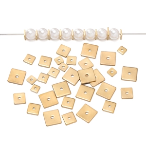 Close-up of golden square stainless steel spacer beads used with white pearls