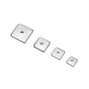 Detailed view of polished stainless steel square beads with center holes in four sizes