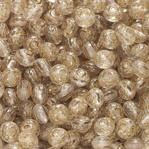 Makroaufnahme von Acrylperlen mit Goldmuster für die DIY-Schmuckherstellung