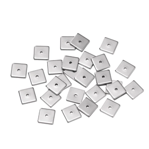 Detailed view of polished square stainless steel spacer beads for DIY jewelry making