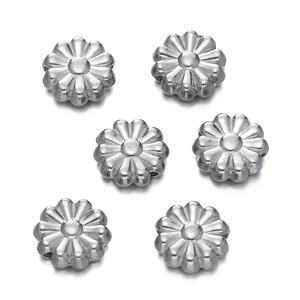 Macro shot of silver stainless steel daisy flower beads for DIY jewelry making