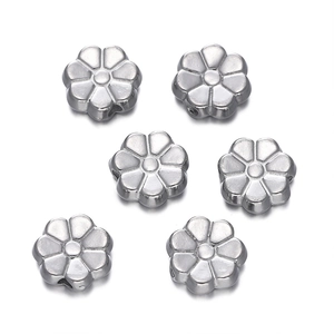 Detailed view of six-petal silver stainless steel flower spacer beads for DIY jewelry
