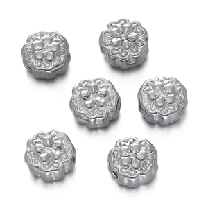 Close-up of six-petal flower beads in polished silver stainless steel for DIY jewelry