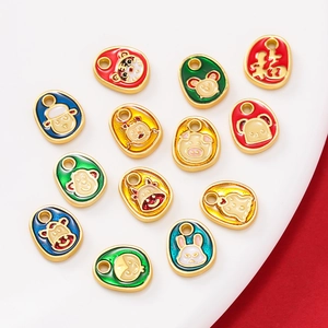 Detailed view of colorful enamel zodiac pendants with Fu character on festive red background