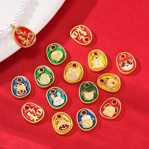 Detail of colorful enamel zodiac pendants with gold finish and lucky Fu character motifs
