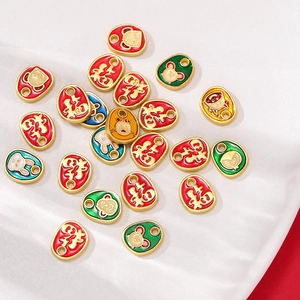 Detail of colorful enamel charms with Chinese Fu character and cute cartoon animals
