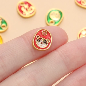 Macro shot of an alloy zodiac tiger pendant with colorful enamel and Fu character detail