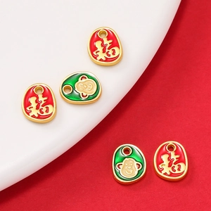 Detail of enamel zodiac monkey and Fu character charms for DIY necklace jewelry making