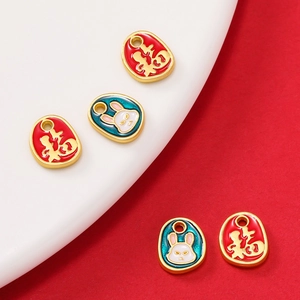Detail showing enamel zodiac charms with golden Fu character and cute rabbit designs