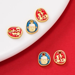 Macro detail of alloy zodiac charms with gold finish and colorful enamel fu character