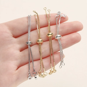 Pulseras de cadena box ajustables en oro de 18K y plata con cuenta deslizante y dijes de circón