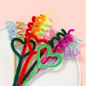 Colorful plush pipe cleaners in heart and spiral shapes for creative DIY craft projects