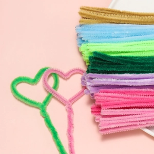 Detailed texture of colorful plush chenille stems twisted into handmade heart shapes