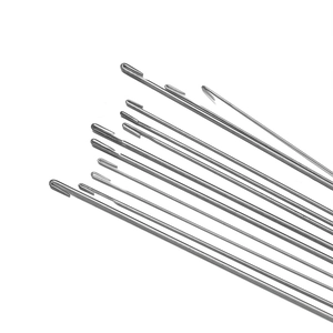 Macro view of stainless steel beading needles with polished finish and latch hook tip