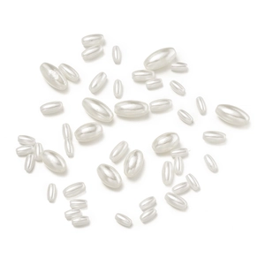 Close-up of assorted sizes of oval ABS imitation pearls for DIY jewelry making