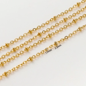 Macro detail of 1.8mm gold-plated O-chain with 2.3mm beads for DIY jewelry making