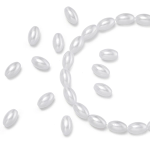 Macro detail of oval ABS imitation pearl beads with elegant luster for DIY jewelry making