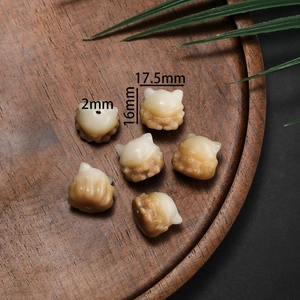 Detailed view of cat-shaped Bodhi root carved beads with 2mm holes for DIY jewelry making