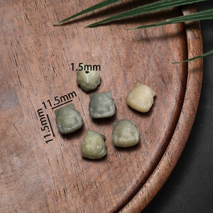 Macro detail of hand-carved cat-shaped bodhi root beads with 11.5mm size measurement