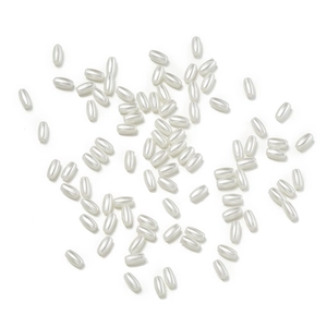 Macro shot of oval ABS imitation pearls in cream white for DIY jewelry and accessories