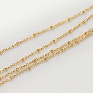 Close-up of 1.8mm gold-plated O-chain with small beads for DIY jewelry making