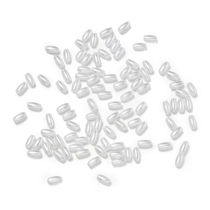 Macro detail of oval cream ABS imitation pearl rice beads with vertical holes for DIY