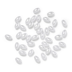 Detailed view of oval ABS imitation pearls in cream white for DIY jewelry making accessories