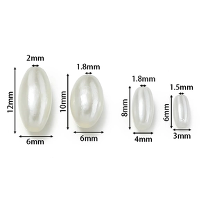 Detail showing four sizes of ivory oval ABS imitation pearl beads for jewelry DIY