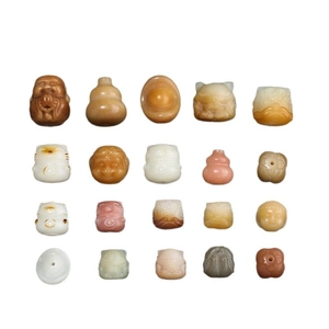 Variety of carved Bodhi seed beads featuring Buddha, lucky cats and fortune ingots