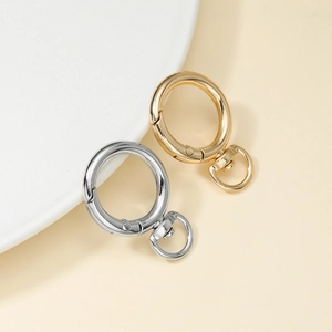 Macro detail of gold and silver zinc alloy spring O-rings with rotating D-rings