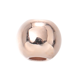 Dettaglio di perle metalliche oro rosa con finitura a specchio liscia per gioielli fai-da-te