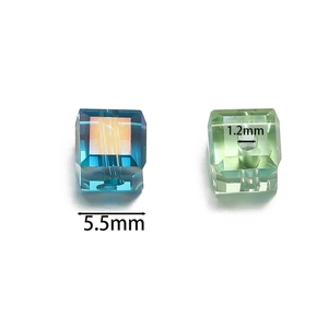 Macro view showing 5.5mm faceted cube glass beads with AB coating and 1.2mm center hole