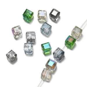 Detailed macro view of 6mm faceted crystal cube beads with precision drilled holes