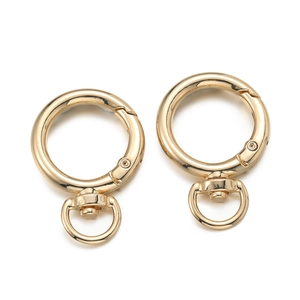 Close-up of golden zinc alloy spring O-rings with 360-degree rotating D-ring hardware