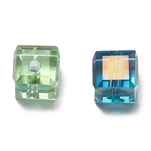 Macro detail of 6mm faceted crystal glass cubes in light green and AB blue finish