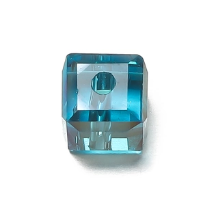 Detailed macro view of a 6mm faceted crystal glass cube bead in transparent lake blue