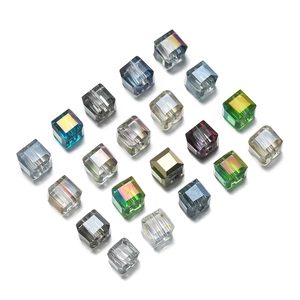 Close-up of 6mm faceted glass sugar cube beads in various colors for DIY jewelry