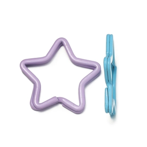 Detail view of colorful star-shaped metal key rings with durable spray paint finish
