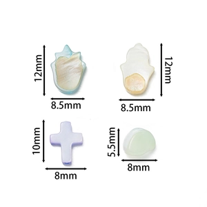 Detail view of colorful shell beads in palm, cross, and round shapes for DIY jewelry