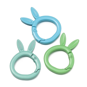 Three rabbit-ear spring o-rings in matte blue and green for DIY keychain accessories