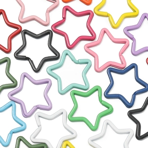 Close-up of star-shaped colorful metal key rings for DIY accessories and bag charms