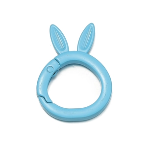 Macro shot of light blue matte bunny spring buckle for DIY keychain and bag accessory
