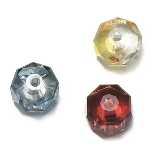 Macro shot of faceted crystal rondelle beads in blue, red and champagne for DIY jewelry