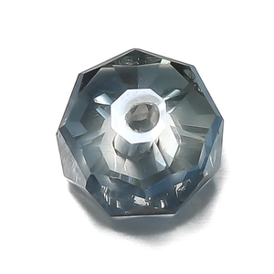Macro shot of gray crystal wheel bead with faceted glass surface and center hole