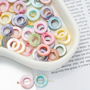 Pastel mixed color marble resin bead accessories for DIY jewelry in a white tray