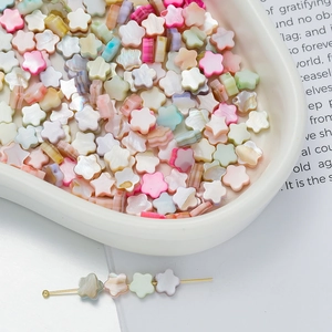 Macro shot of macaron colored floral beads with pearlescent finish for DIY jewelry