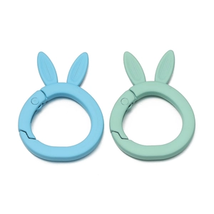 Close-up of matte alloy rabbit ear spring buckles in light blue and mint green